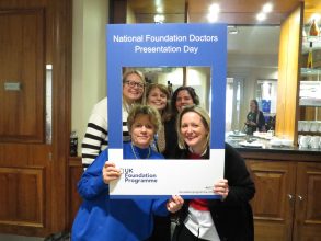 Foundation school staff and foundation doctors posing together in a NFDPD selfie frame