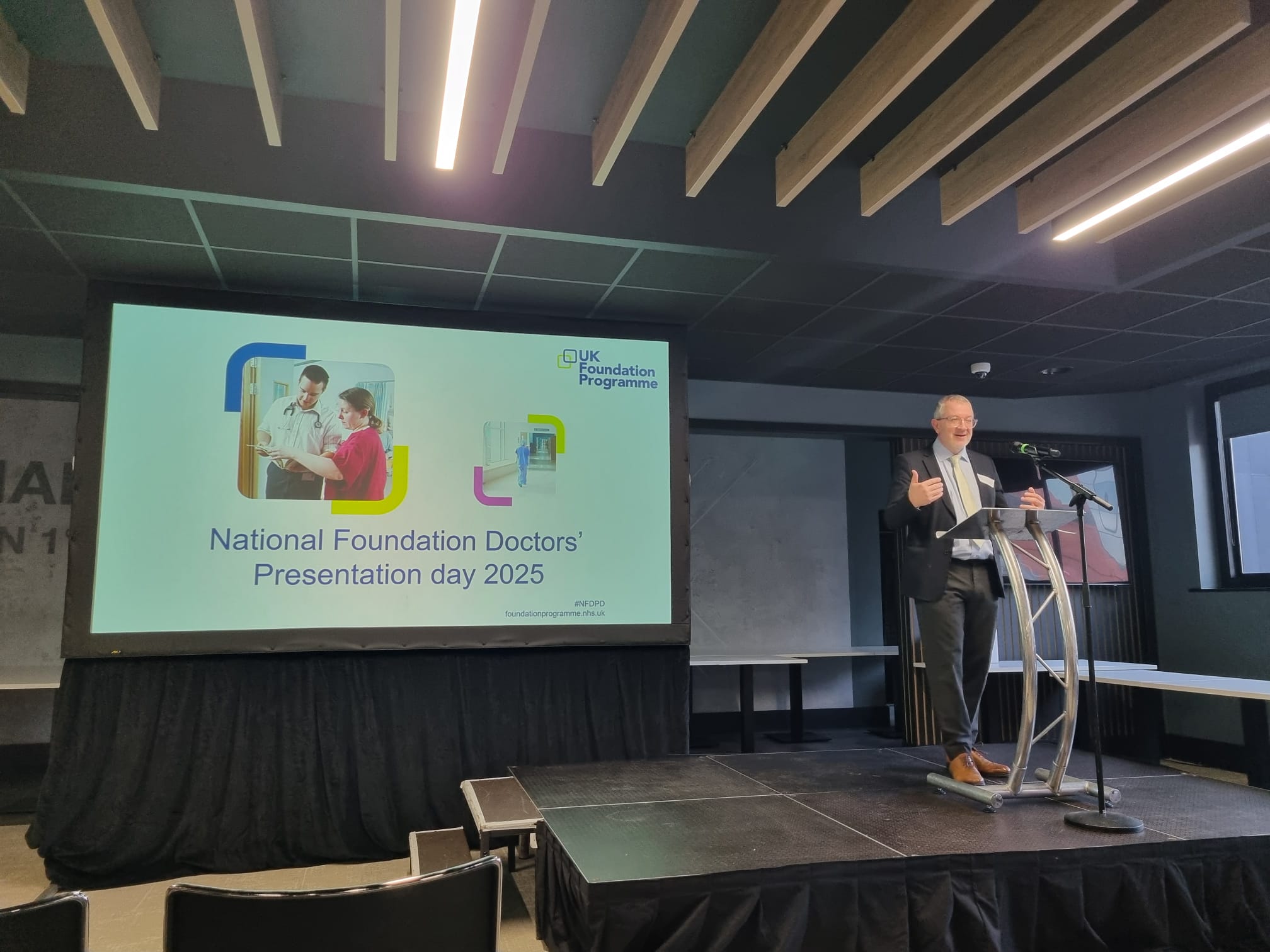 Dr Mike Masding at the podium in the main hall