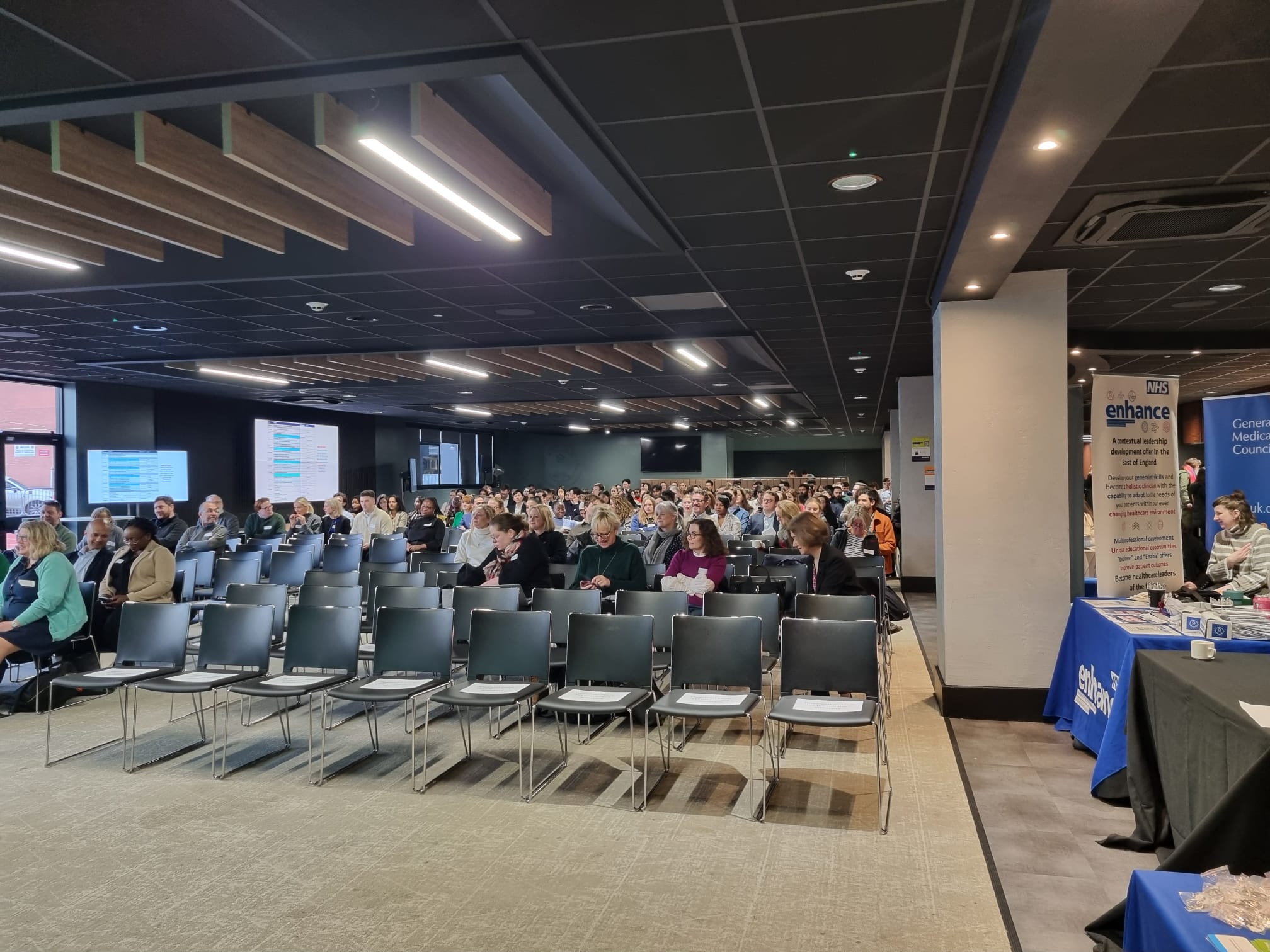 Audience viewing a presentation in the main hall