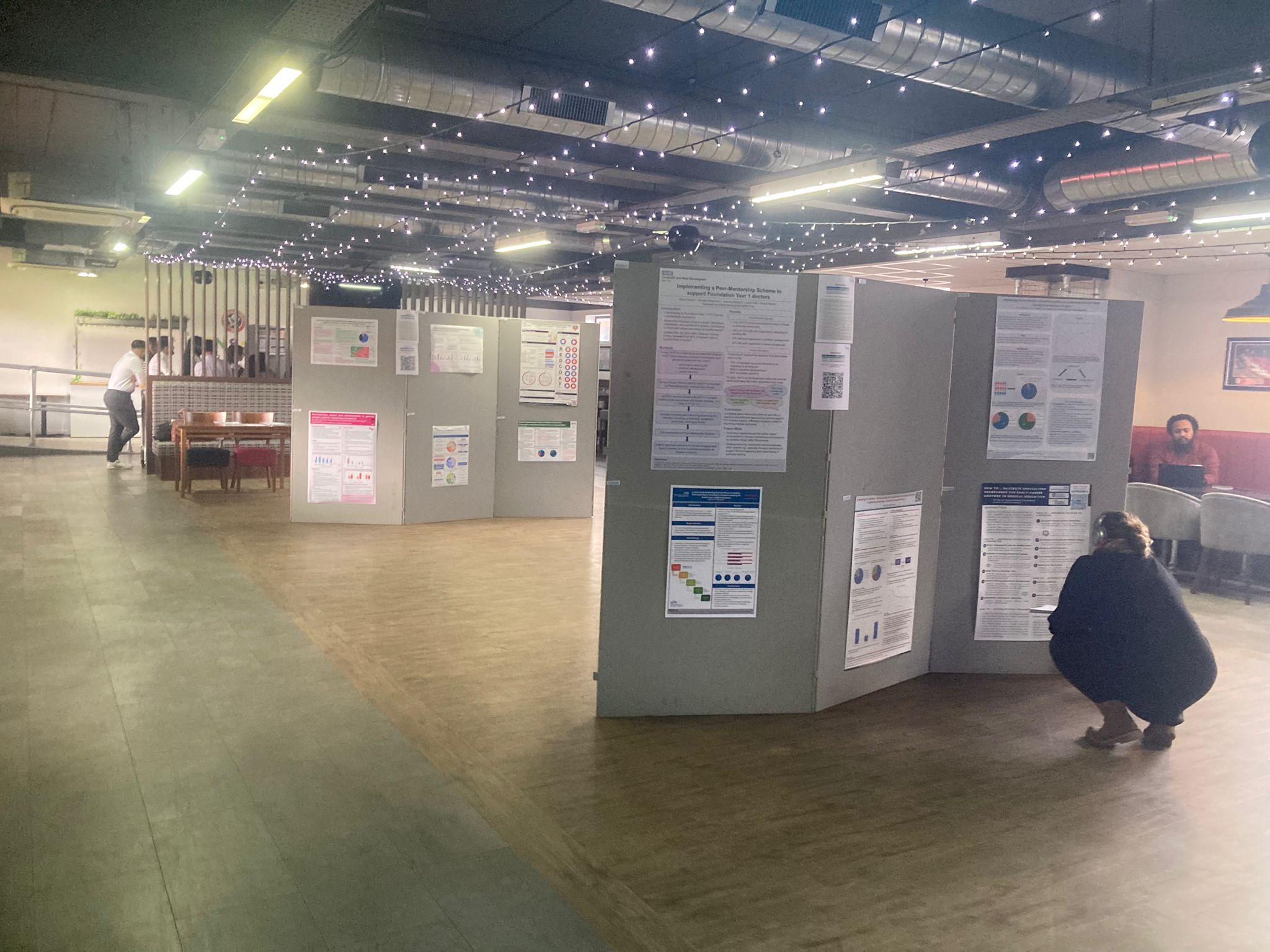 Attendee viewing poster boards