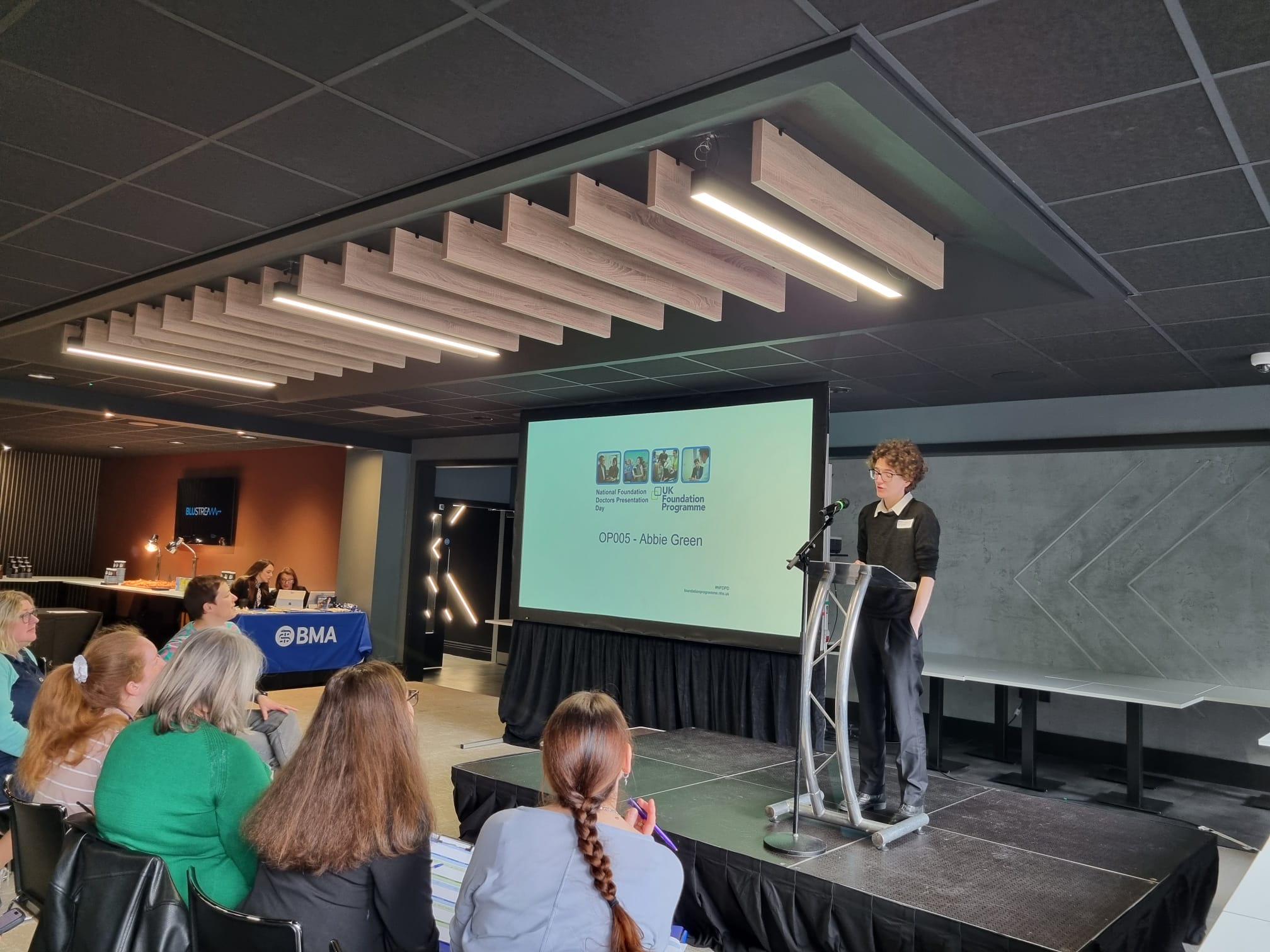 Image of foundation doctor presenting their oral presentation in the main hall