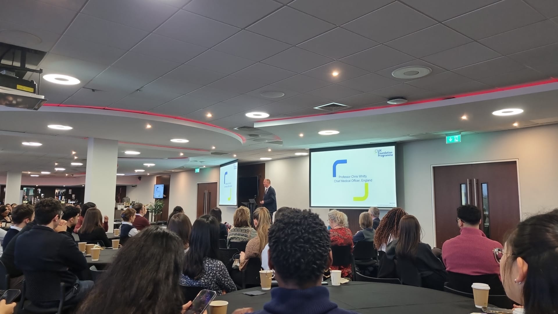 Audience viewing a presentation in the main hall 