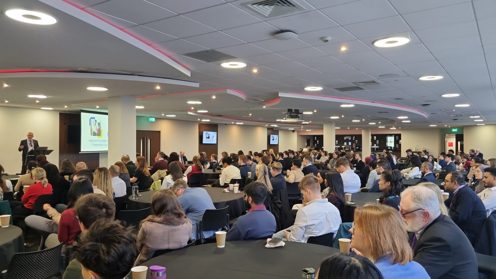 Audience listening to a presentation in the main hall 