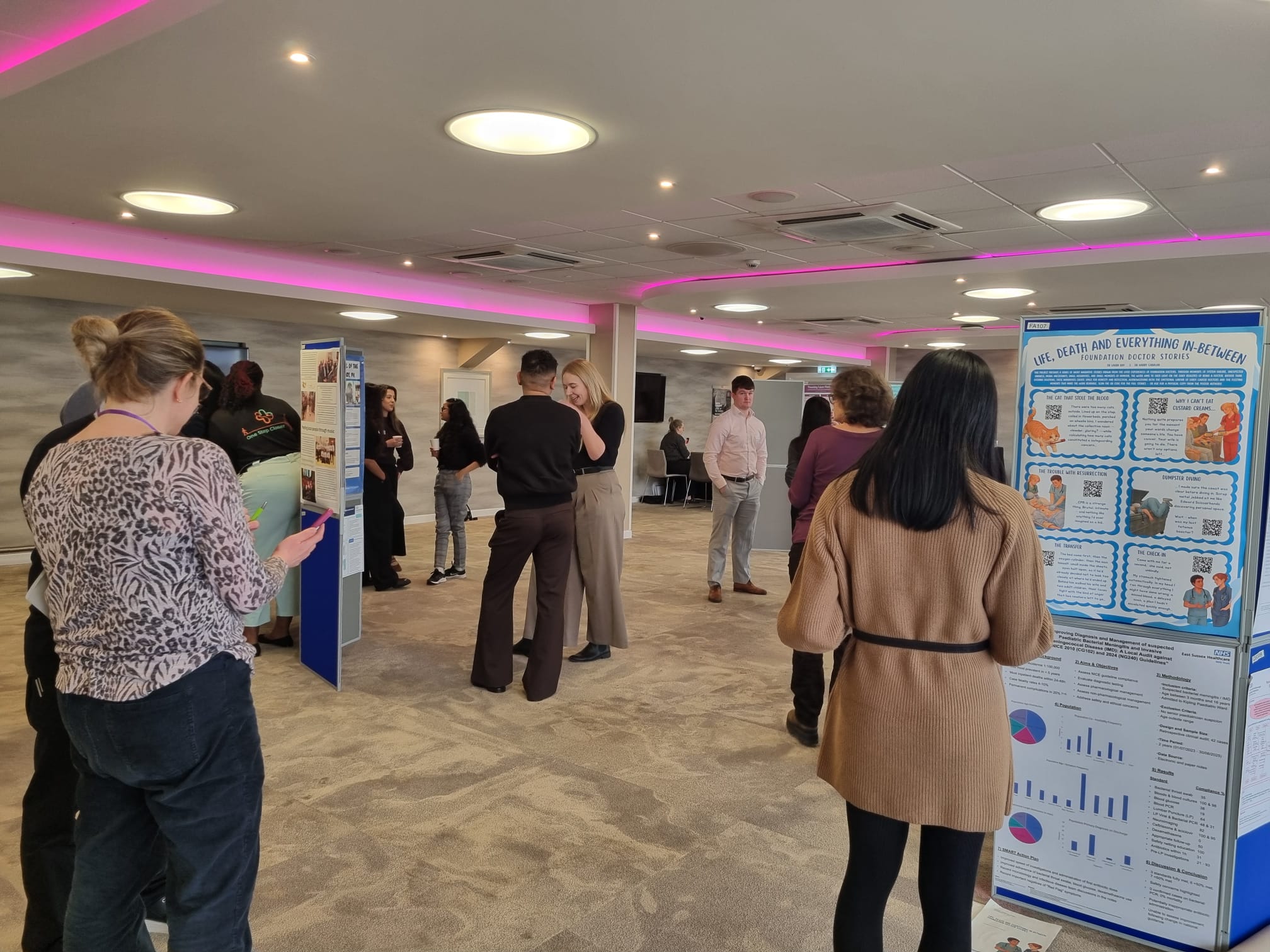 Image of foundation doctors reading poster boards