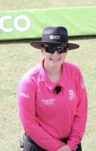 F1 doctor smiling in their international cricket umpire uniform